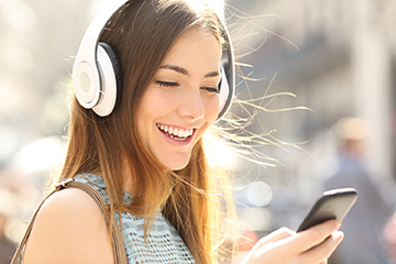 woman listening to podcast